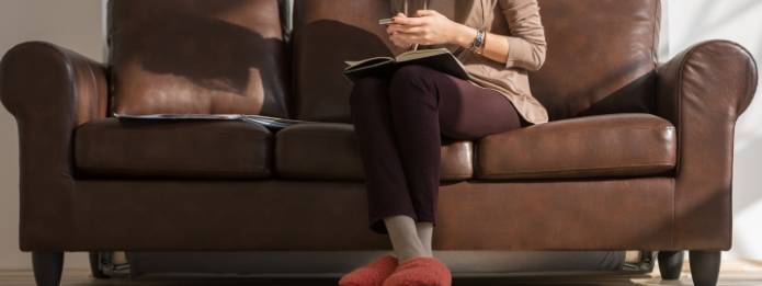 Individual sitting on a couch