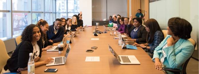 Employees talking in a room with a table